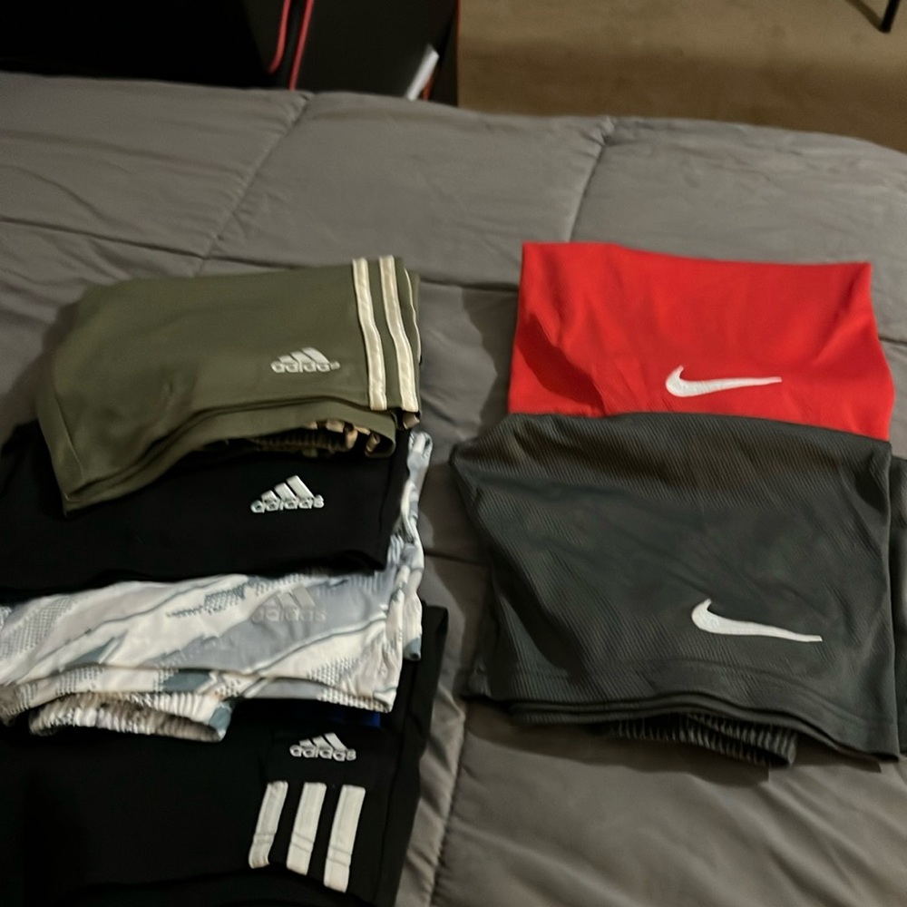 6 pair of size YM Nike and Adidas shorts
